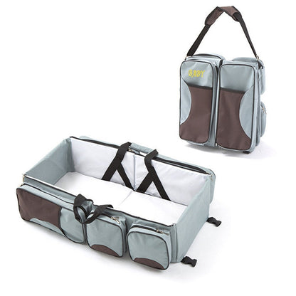 Baby Folding Bed Mommy Bag with portable baby bed, large storage compartments, and comfortable shoulder straps for travel and everyday parenting