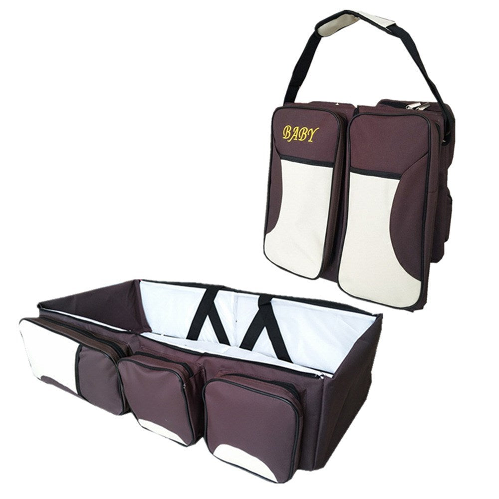 Baby Folding Bed Mommy Bag with portable baby bed, large storage compartments, and comfortable shoulder straps for travel and everyday parenting