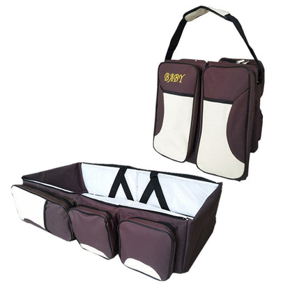 Baby Folding Bed Mommy Bag with portable baby bed, large storage compartments, and comfortable shoulder straps for travel and everyday parenting