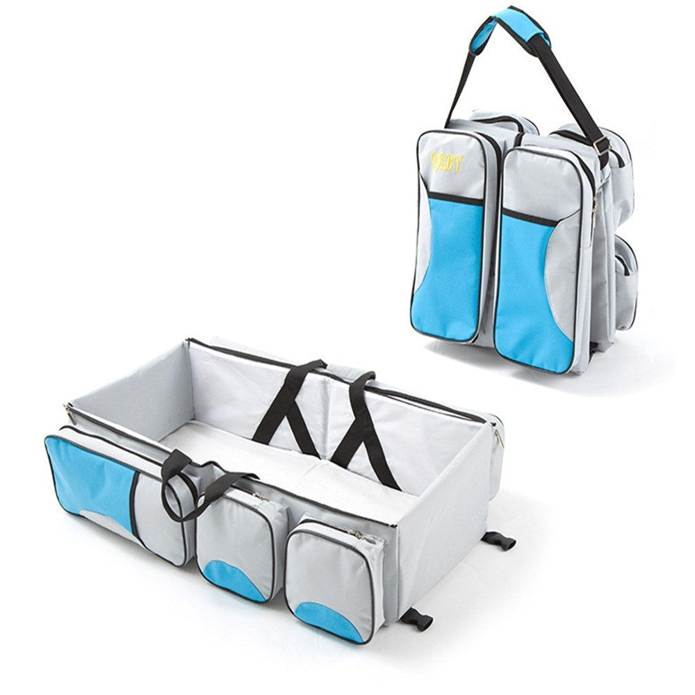 Baby Folding Bed Mommy Bag with portable baby bed, large storage compartments, and comfortable shoulder straps for travel and everyday parenting