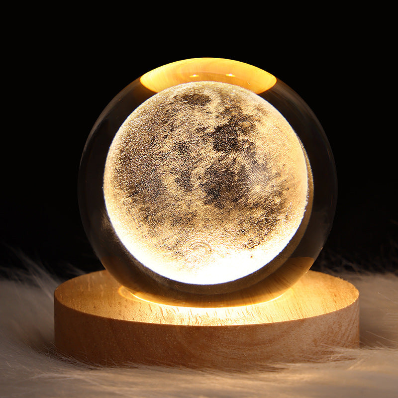 3D Galaxy Crystal Ball Night Light with USB wooden LED base featuring Moon, Saturn, Solar System, and Nebula designs for bedroom décor