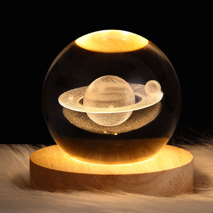 3D Galaxy Crystal Ball Night Light with USB wooden LED base featuring Moon, Saturn, Solar System, and Nebula designs for bedroom décor