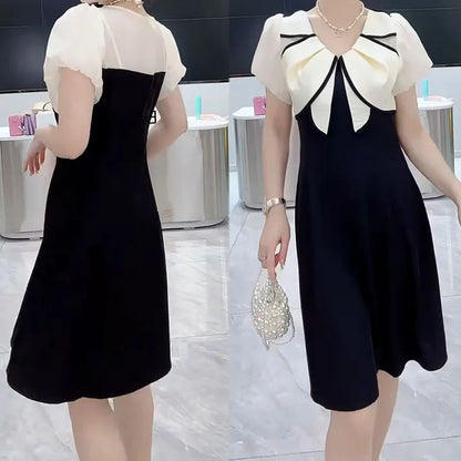 Contrast stitching dress women's summer new fashion temperament slim design sense bubble sleeve foreign dress.