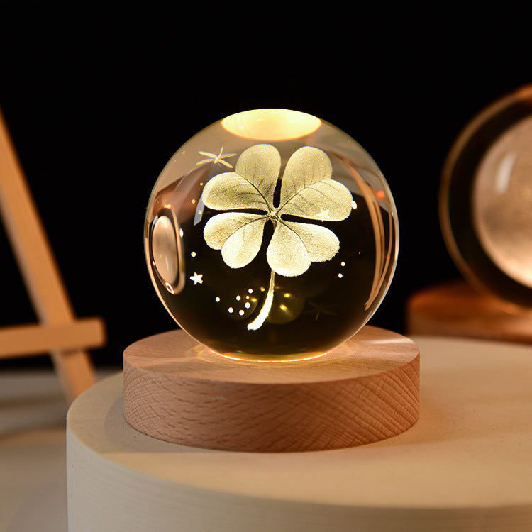 3D Galaxy Crystal Ball Night Light with USB wooden LED base featuring Moon, Saturn, Solar System, and Nebula designs for bedroom décor